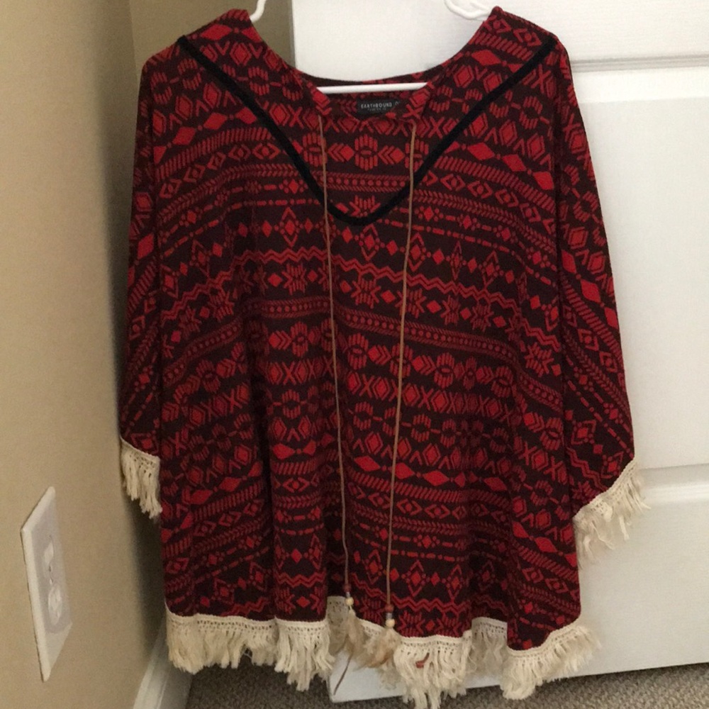 Red shawl with white ruffling